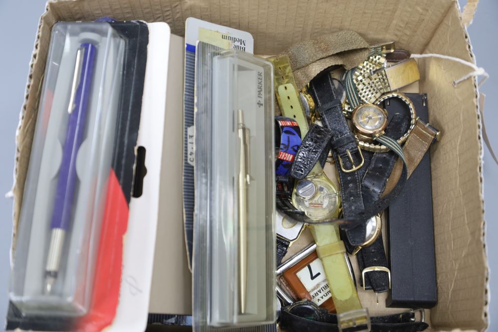 Two early 20th century 9ct. watch heads, sundry other watches and assorted pens